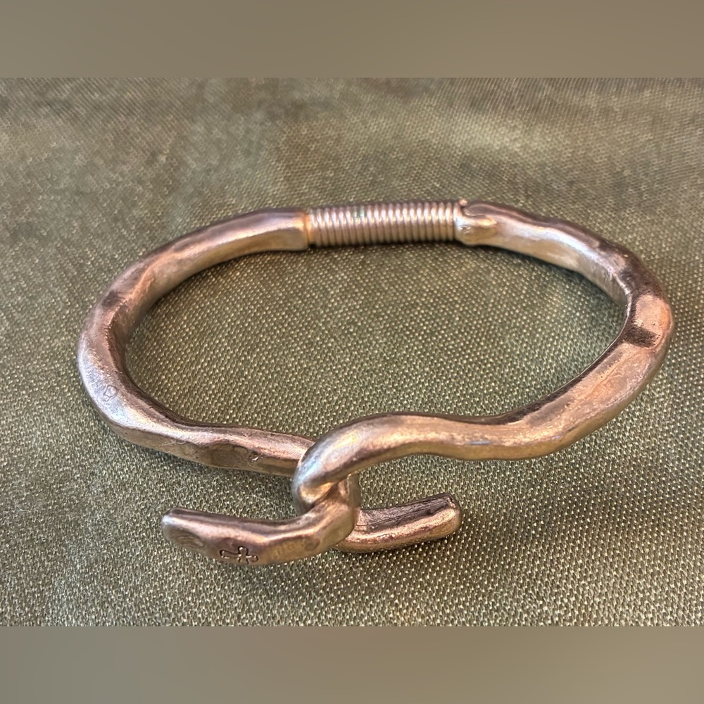 Silver metal plated “Hooked on a Feeling” bracelet with spring hinge.